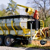 Luggage container with chainsaw holder